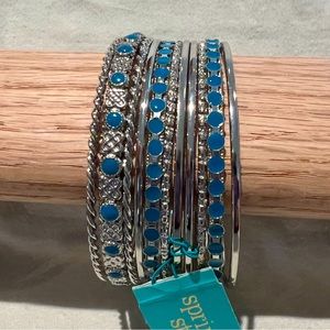 Bangle bracelets in silver tone with turquoise colored designs. (11 bracelets)